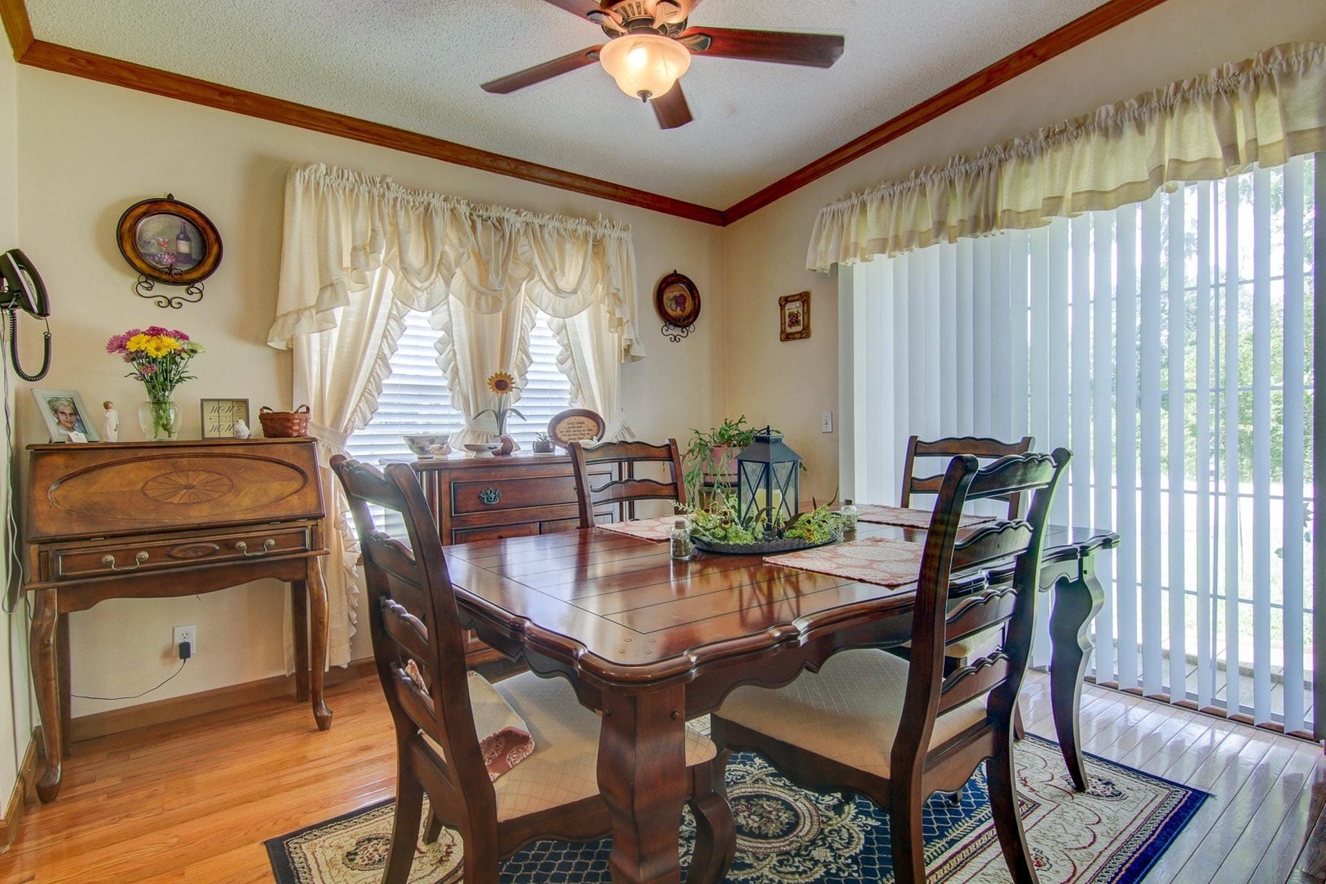 3762 Spradlin Road Goodview, VA 24095 - Photo 11 of 36 a view of a dining room with furniture and chandelier