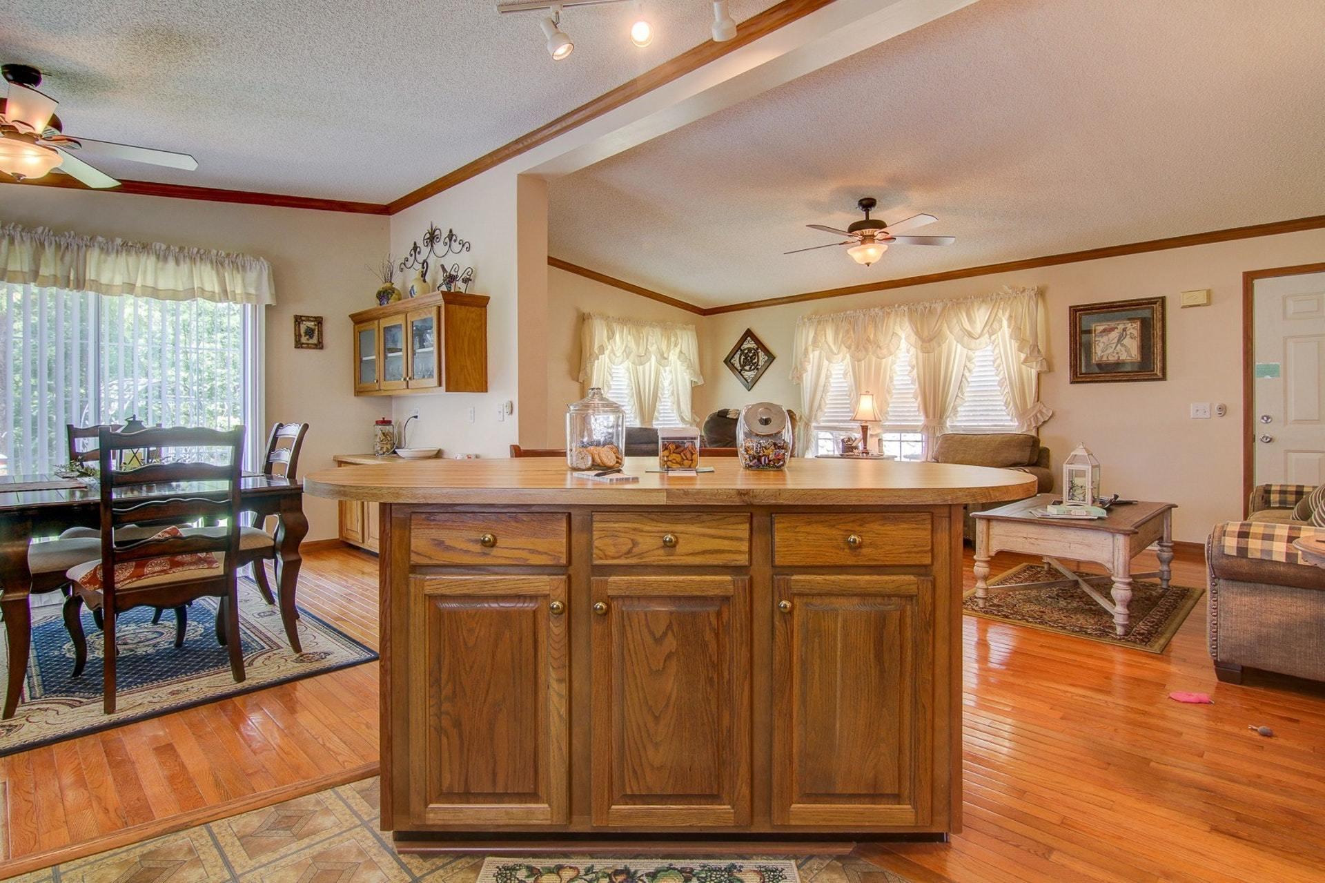 3762 Spradlin Road Goodview, VA 24095 - Photo 13 of 36 a living room with granite countertop furniture and a dining table