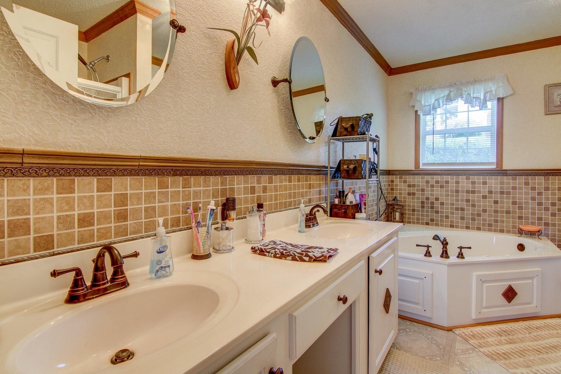 3762 Spradlin Road Goodview, VA 24095 - Photo 19 of 36 a bathroom with a sink and a mirror