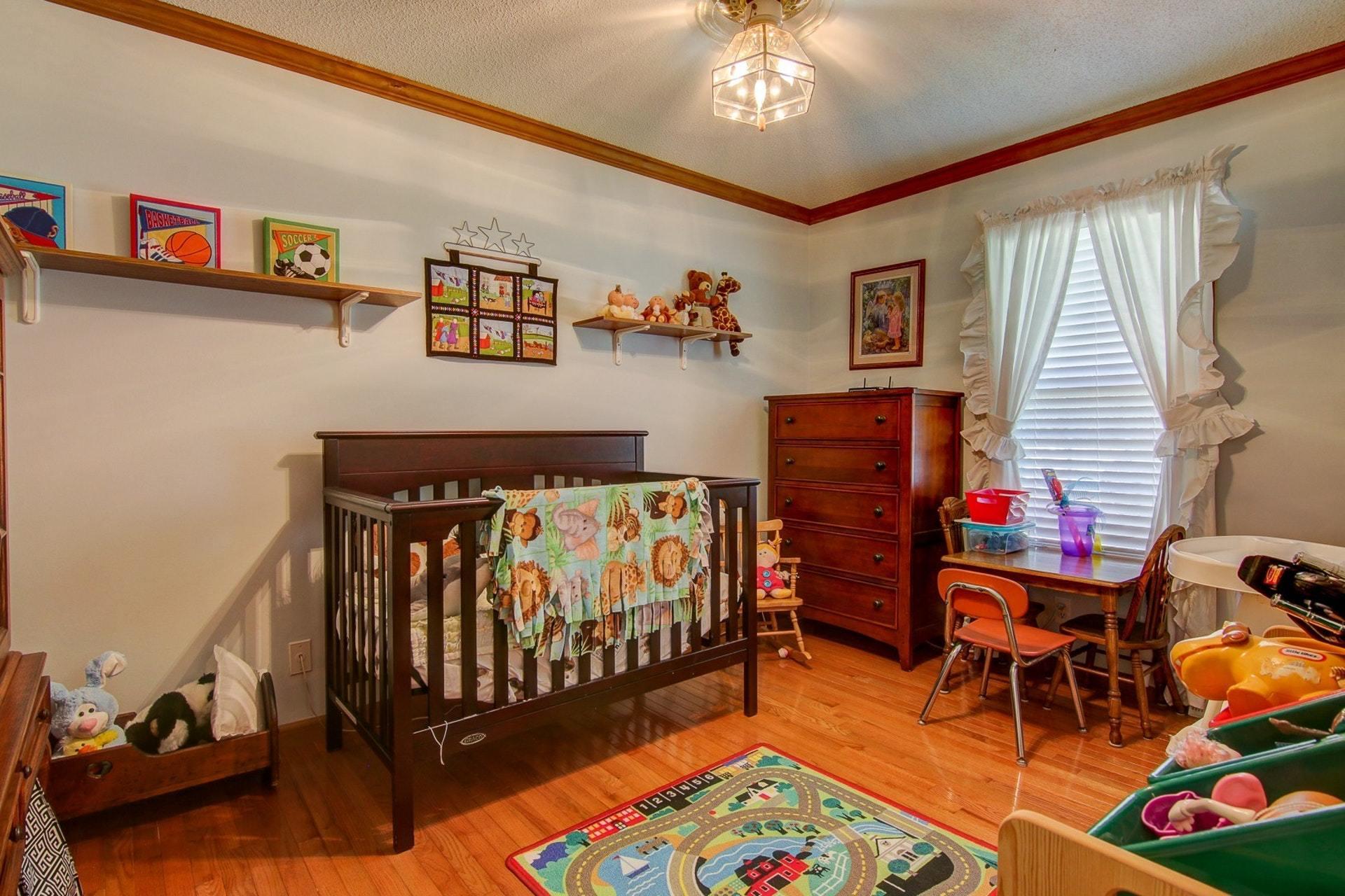 3762 Spradlin Road Goodview, VA 24095 - Photo 23 of 36 a bedroom with furniture and a baby crib