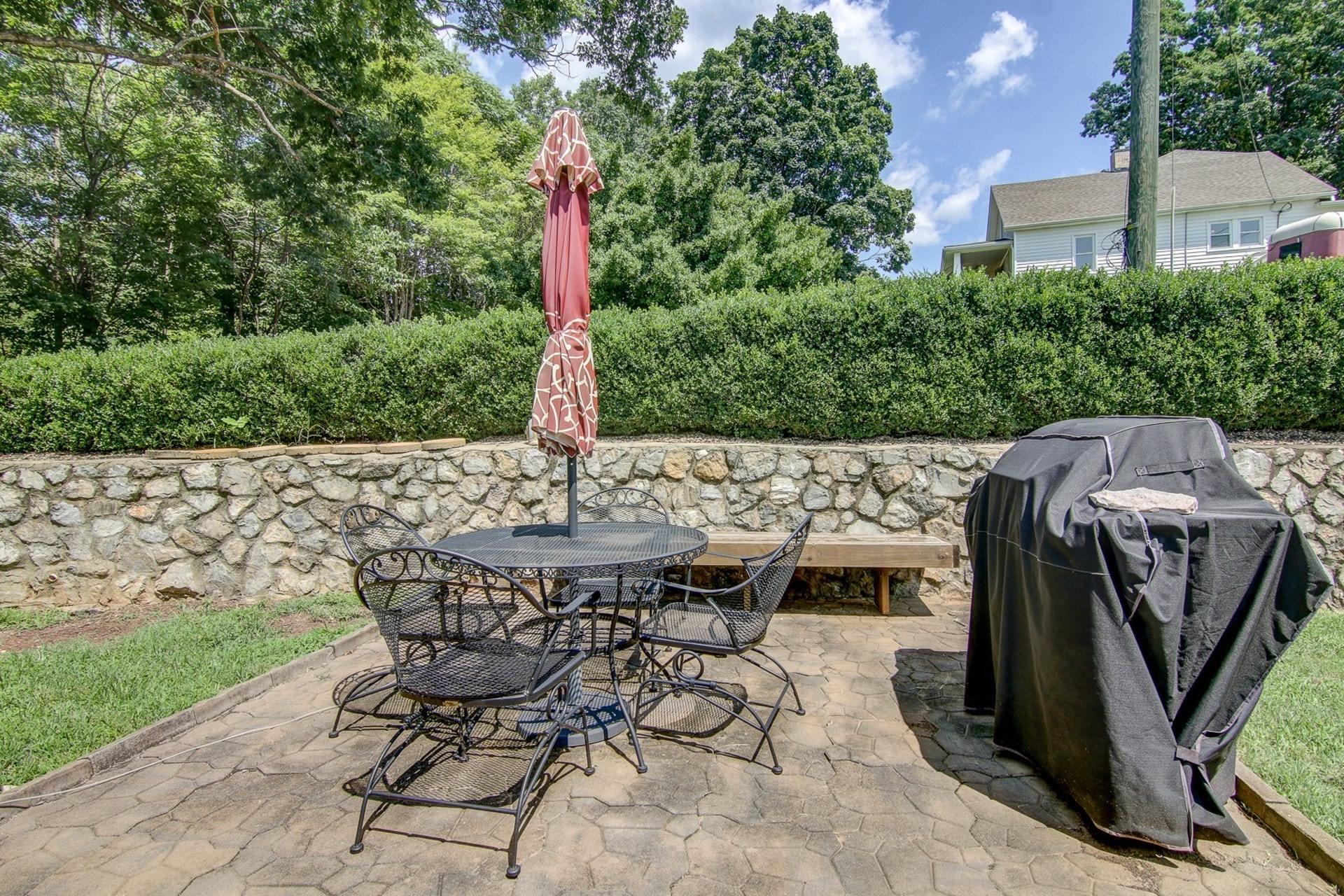 3762 Spradlin Road Goodview, VA 24095 - Photo 25 of 36 a view of a patio with table and chairs and potted plants