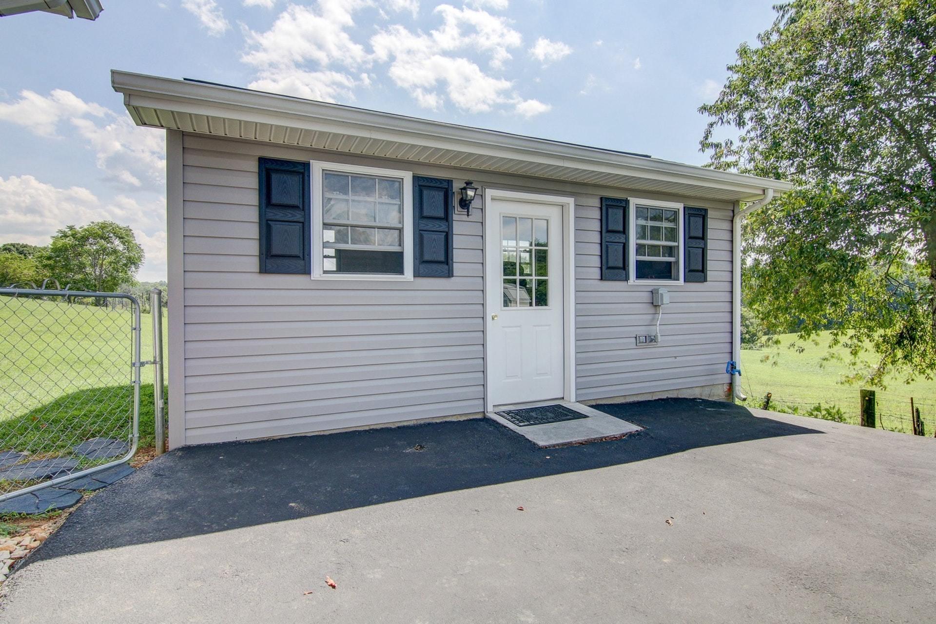 3762 Spradlin Road Goodview, VA 24095 - Photo 29 of 36 a front view of a house with a garage