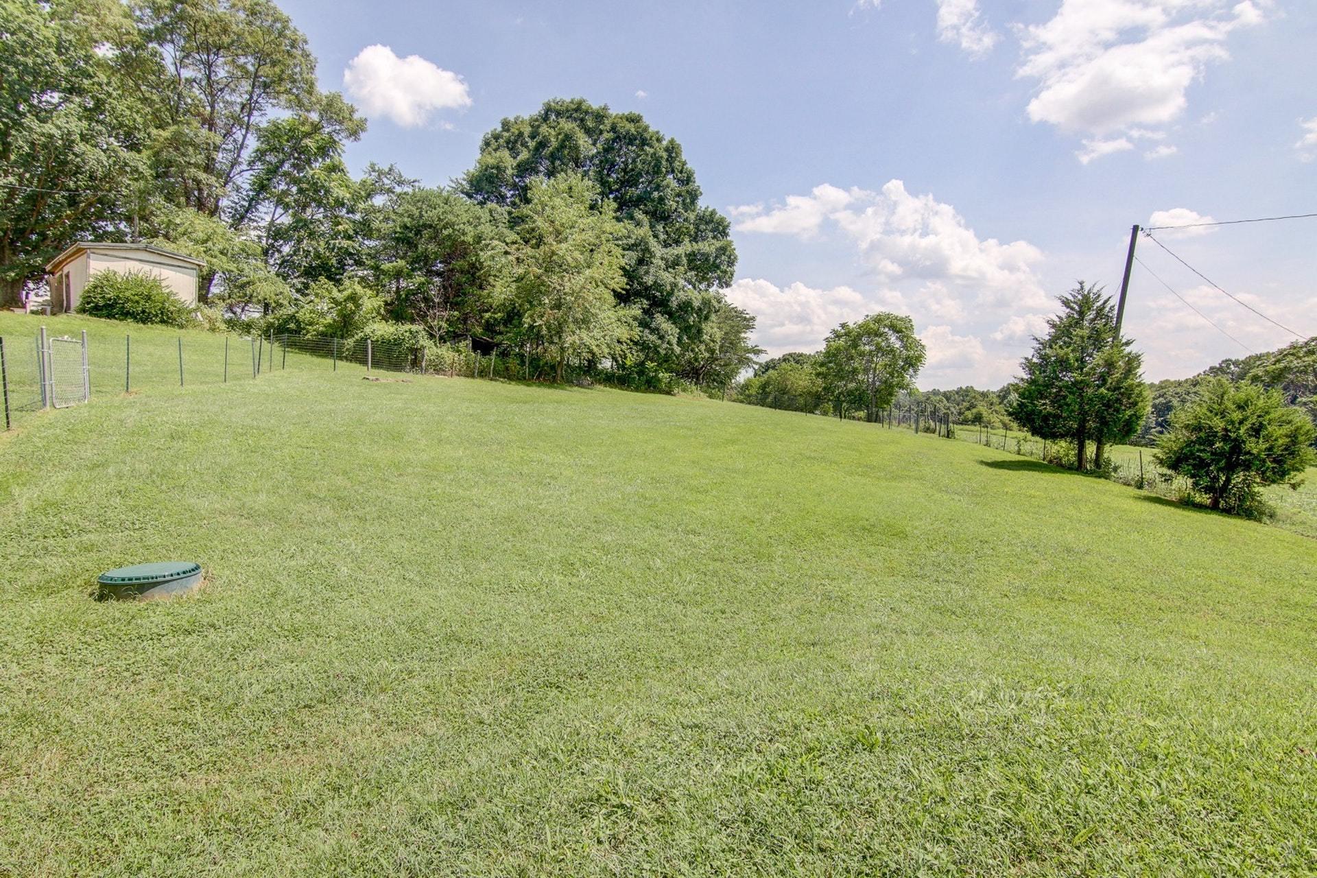3762 Spradlin Road Goodview, VA 24095 - Photo 30 of 36 a view of a field with an trees