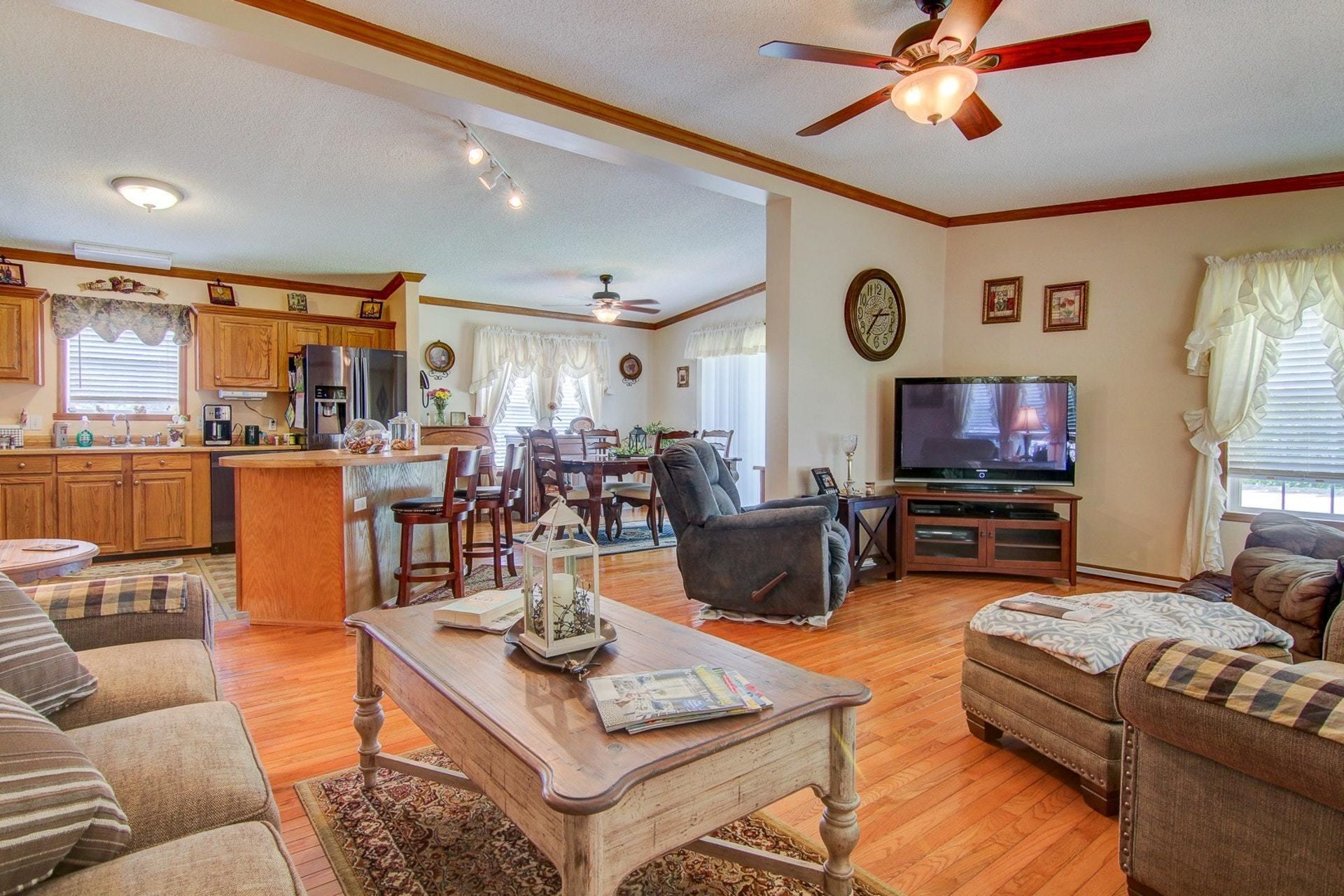3762 Spradlin Road Goodview, VA 24095 - Photo 9 of 36 a living room with furniture and a flat screen tv