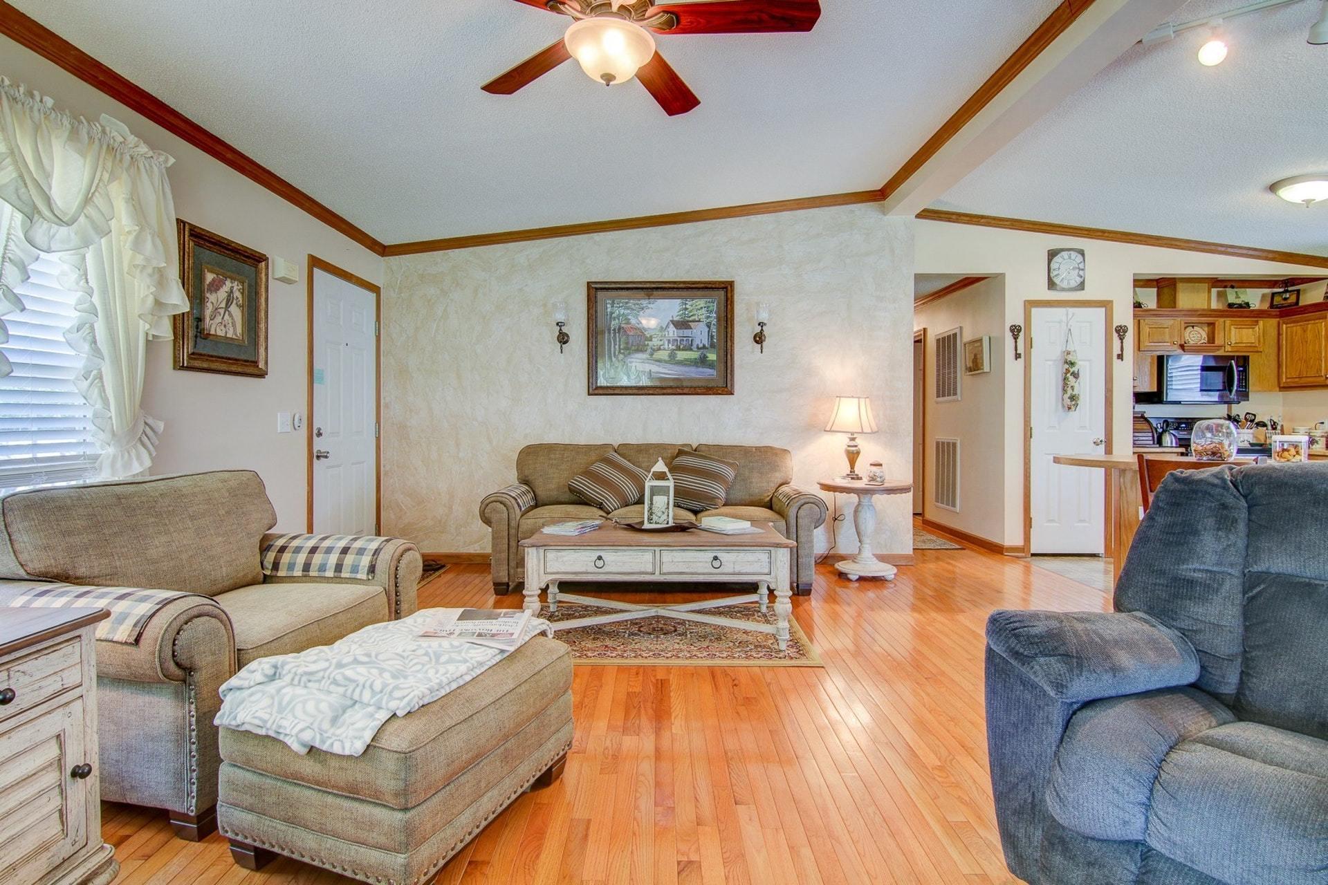 3762 Spradlin Road Goodview, VA 24095 - Photo 10 of 36 a living room with furniture and a wooden floor