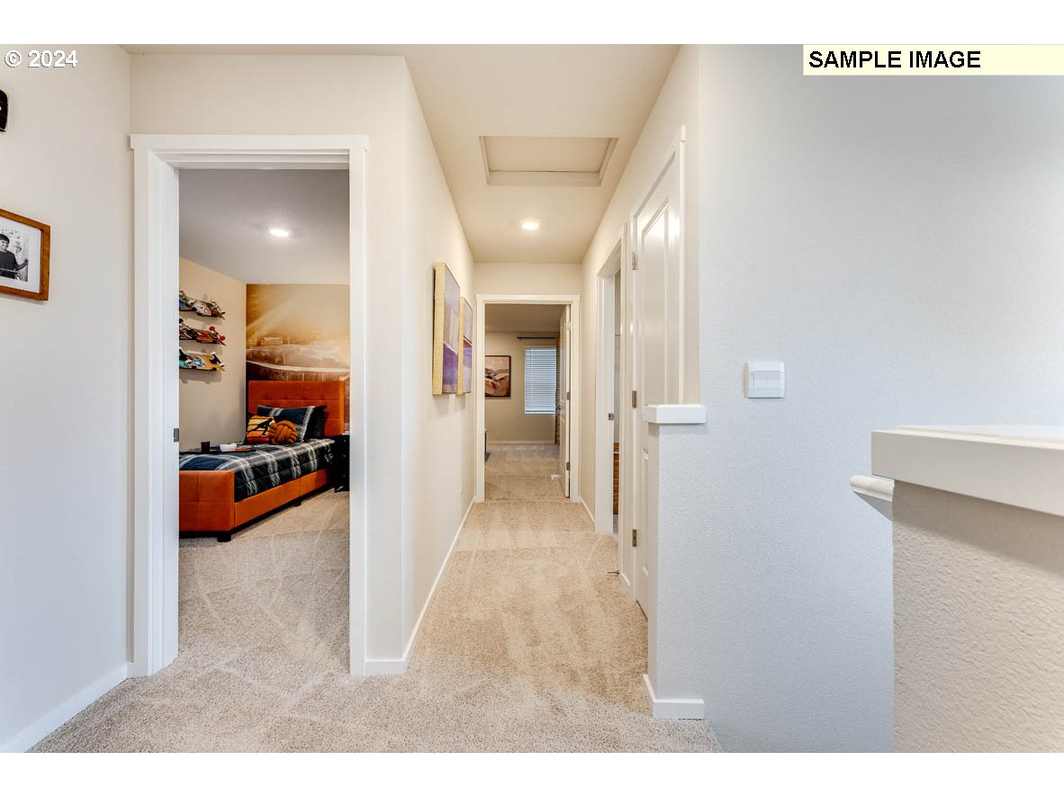 17517 Northwest 10th Place Ridgefield, WA 98642 - Photo 14 of 25 a view of a hallway view with living room and furniture