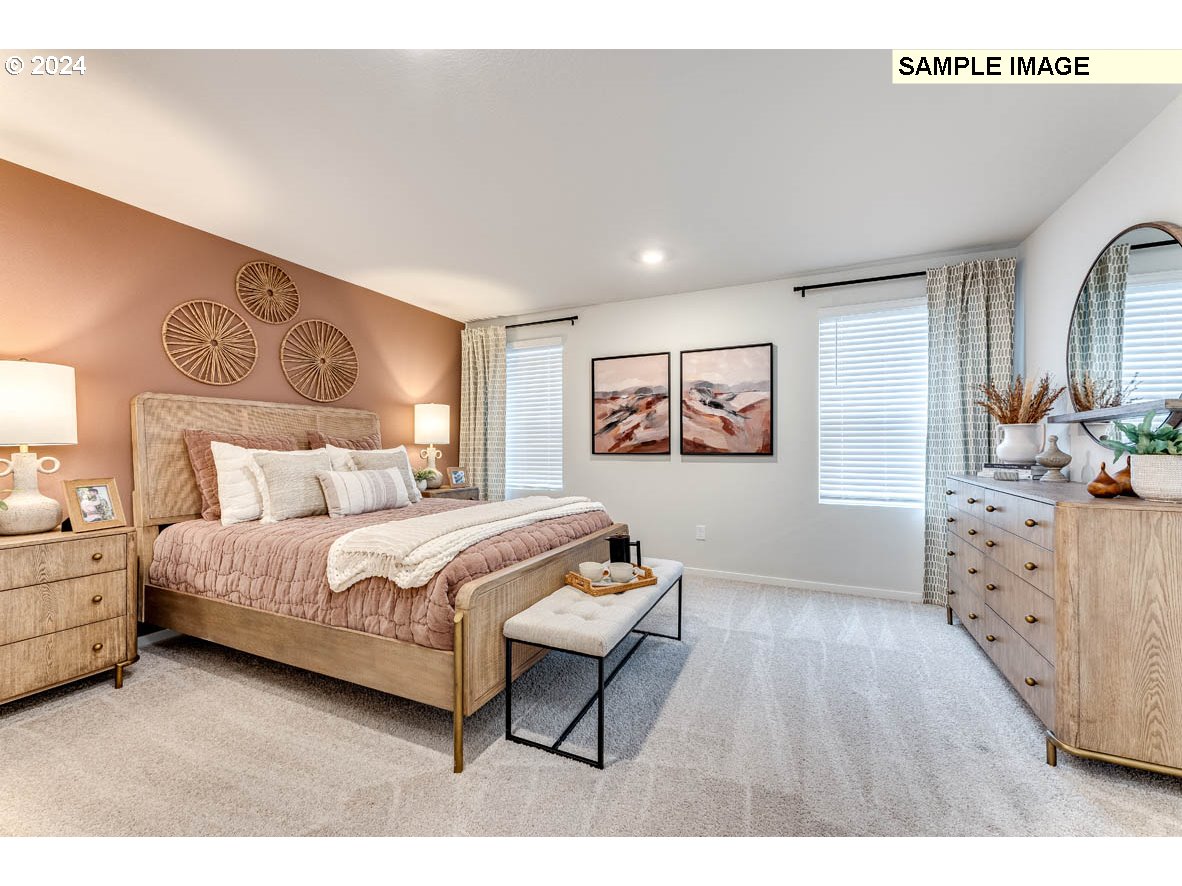 17517 Northwest 10th Place Ridgefield, WA 98642 - Photo 20 of 25 a bedroom with a bed and a dresser