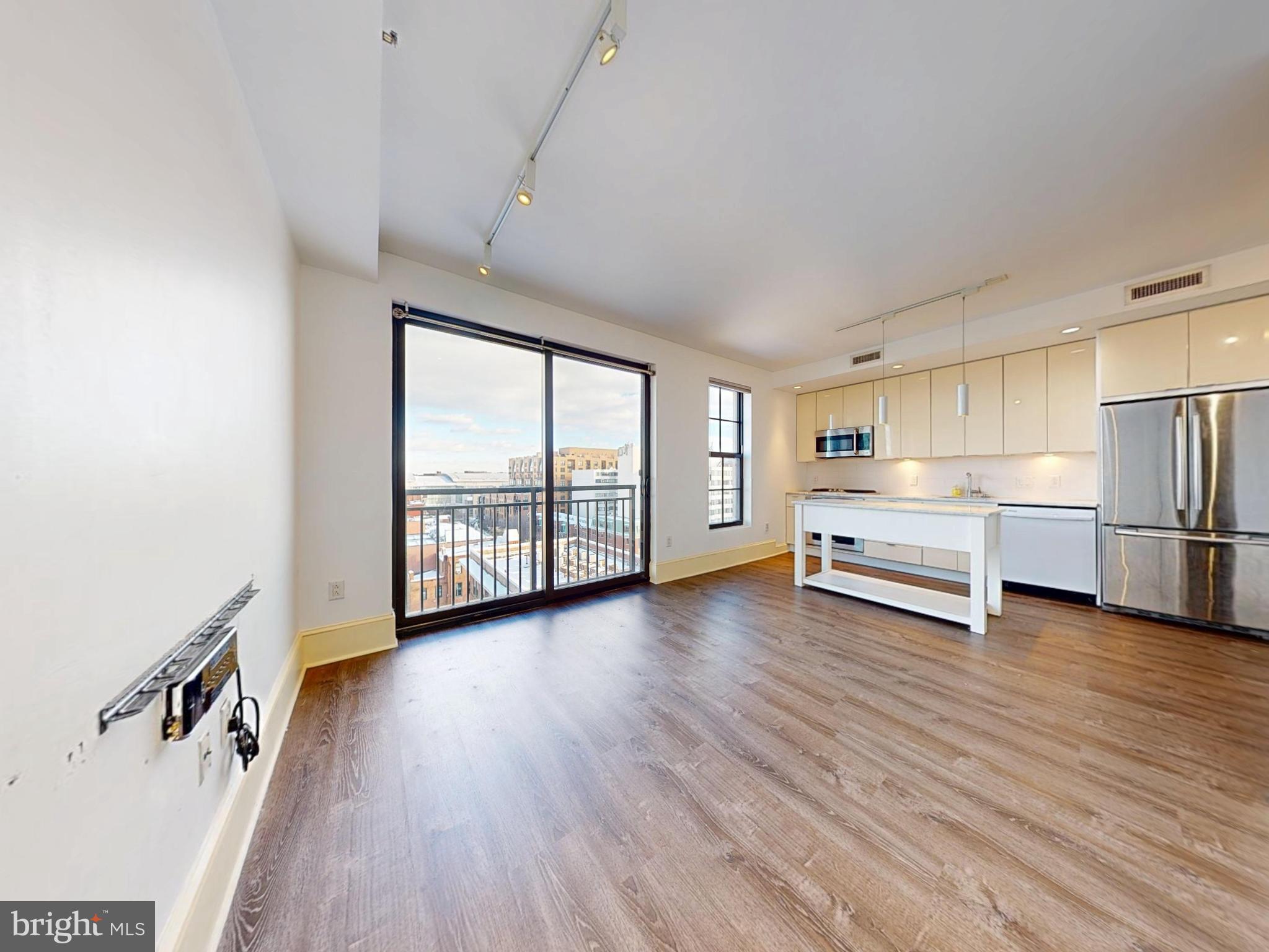 1011 M Street Northwest, Unit 804 Washington, DC 20001 - Photo 9 of 23 Living Space + Kitchen