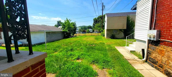 a view of yard with patio