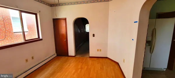 a view of front door with wooden floor