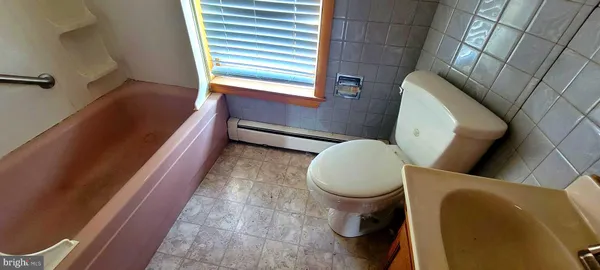 a bathroom with a toilet and a sink