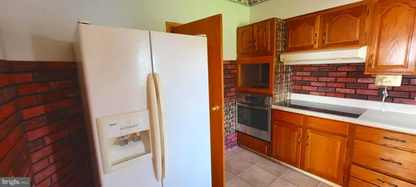 a kitchen with stainless steel appliances a refrigerator and a sink