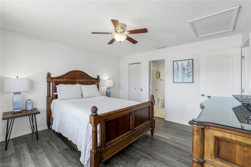 823 Meadowland Drive, Unit H Naples, FL 34108 - Photo 11 of 17 a bedroom with a bed and a window