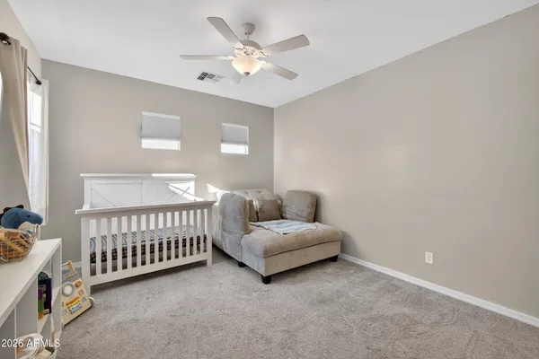 a view of a room with furniture and wooden floor
