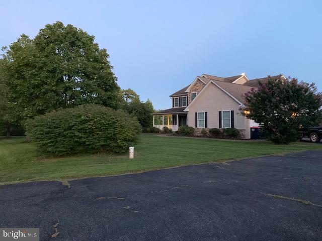 91 Bradley Run Road Elkton, MD 21921 - Photo 1 of 16 a front view of a house with a yard and garage
