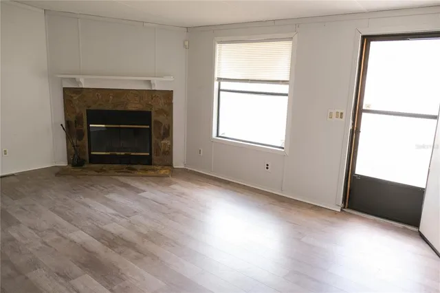 a view of an empty room with a window