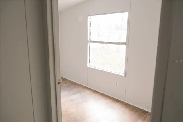 a view of a house with a yard and garden