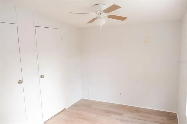 a view of a house with a small yard next to a road