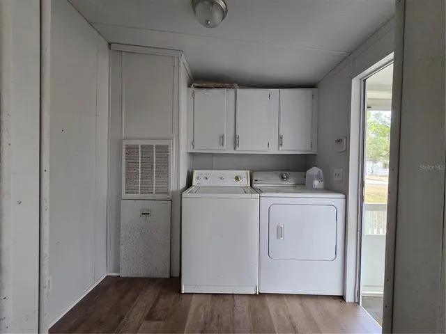a white toilet sitting next to a bath tub