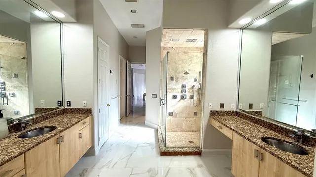 a large kitchen with a stove and a refrigerator