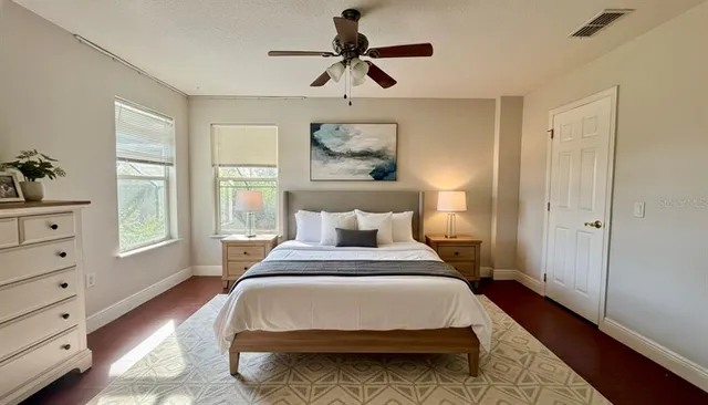 a bedroom with a bed and window