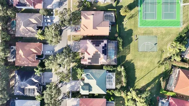 an aerial view of a houses with yard