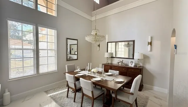 a dining room with furniture and window