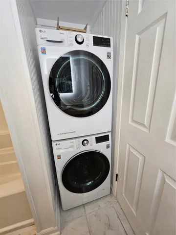 a view of an empty room and wooden floor