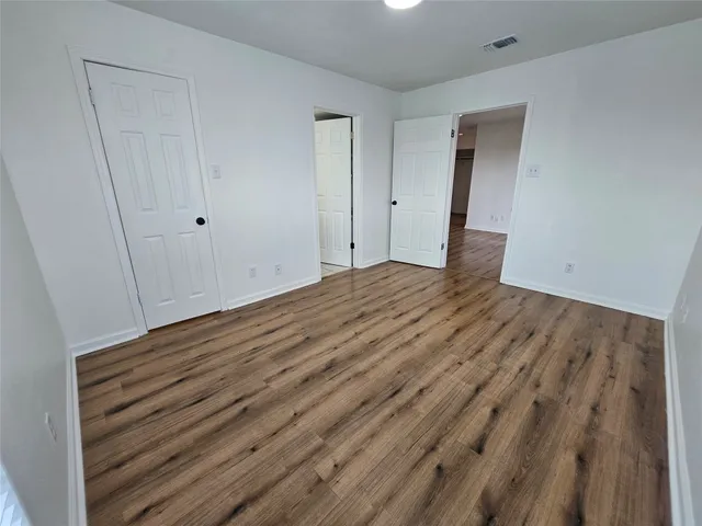 a kitchen with stainless steel appliances a refrigerator sink and microwave