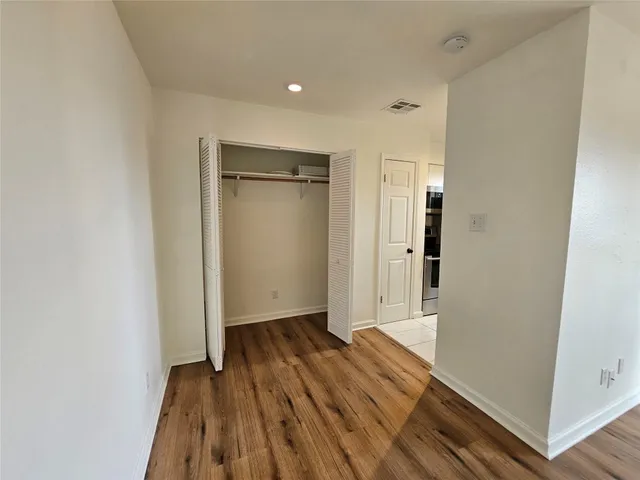 a kitchen with a sink refrigerator and microwave