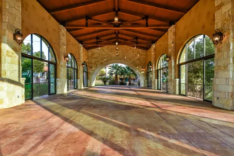 a view of a swimming pool with an outdoor seating
