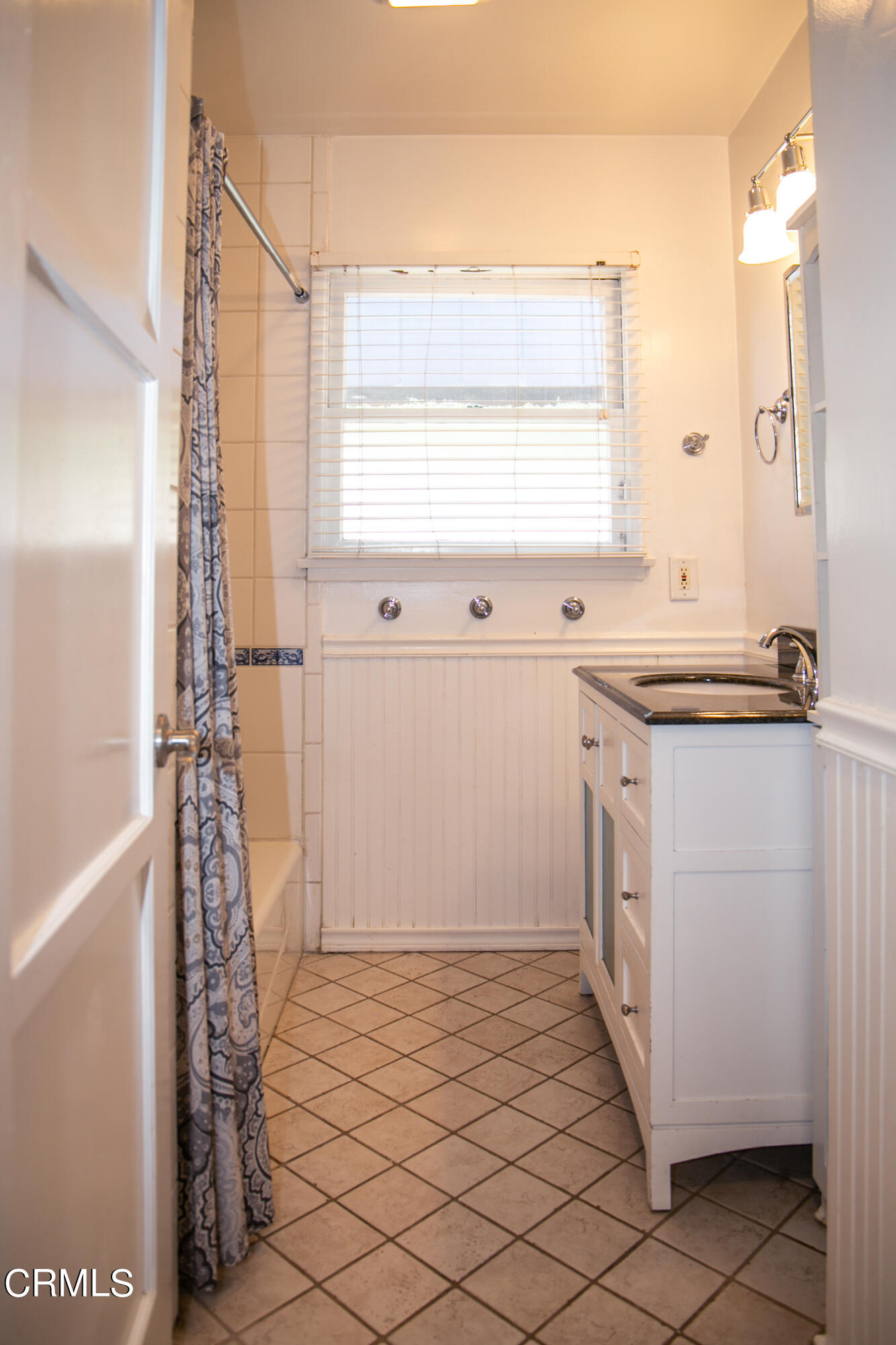 7601 Flight Avenue Los Angeles, CA 90045 - Photo 18 of 36 a room with a window a sink and a mirror