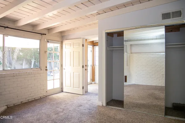 a view of an empty room with a window