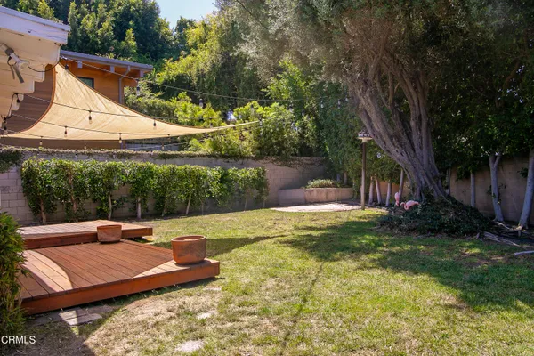 a view of a backyard with a sitting area