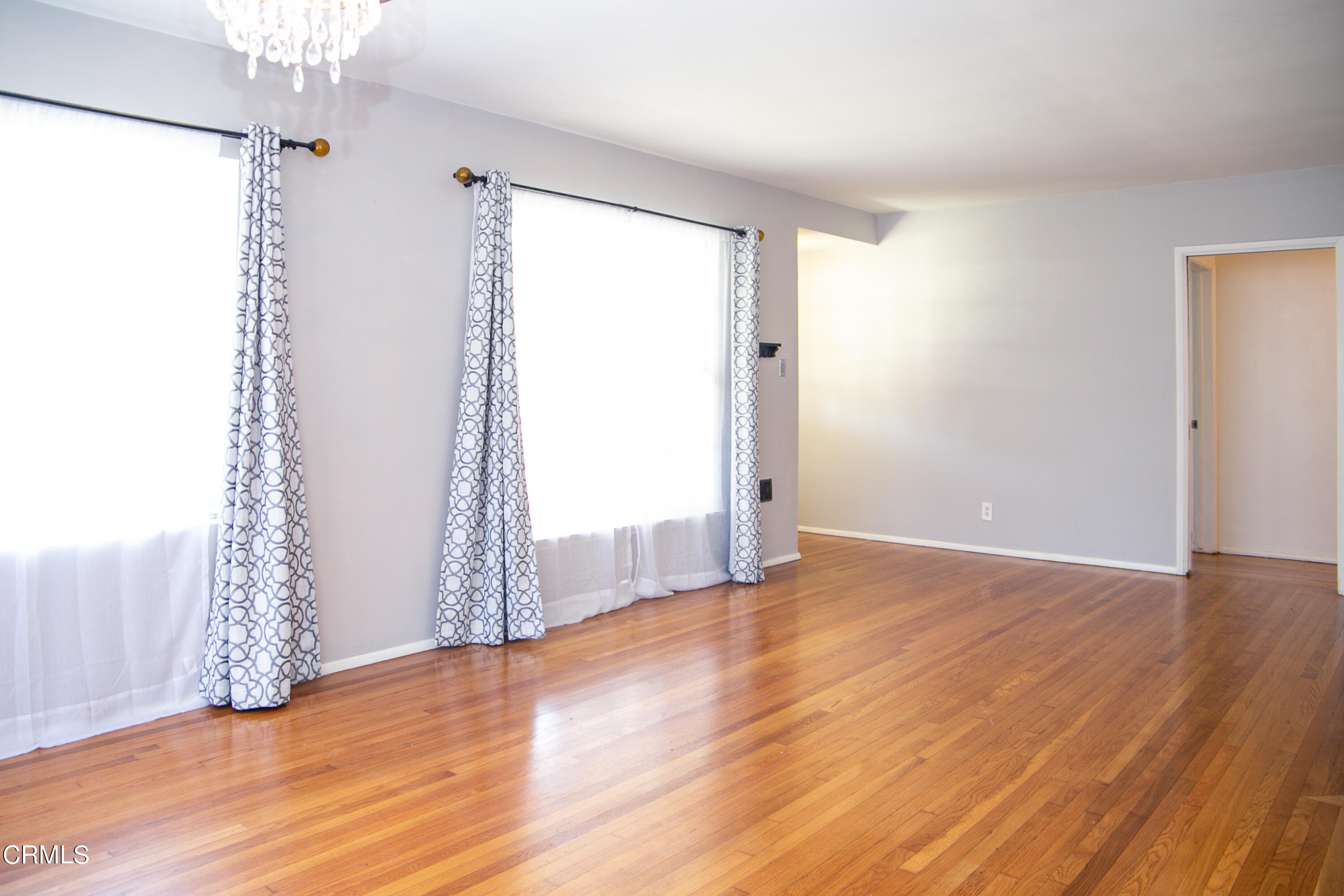 7601 Flight Avenue Los Angeles, CA 90045 - Photo 6 of 36 a view of empty room with wooden floor and fan