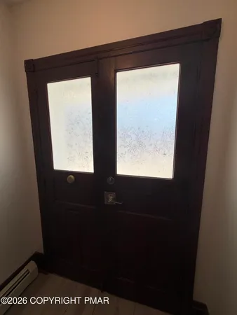a view of an empty room with a window