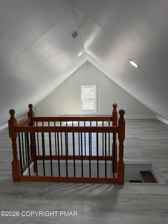 a view of a ceiling fan and wooden floor