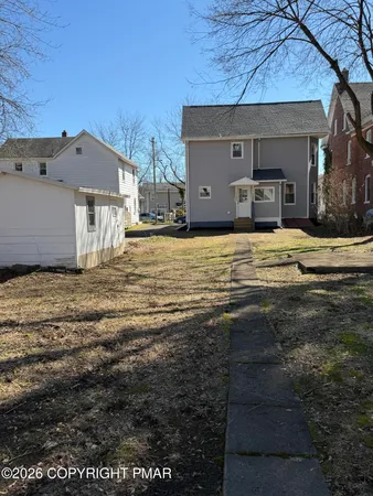 a house view with a outdoor space