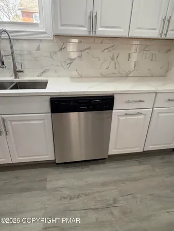 a kitchen with a sink and a microwave