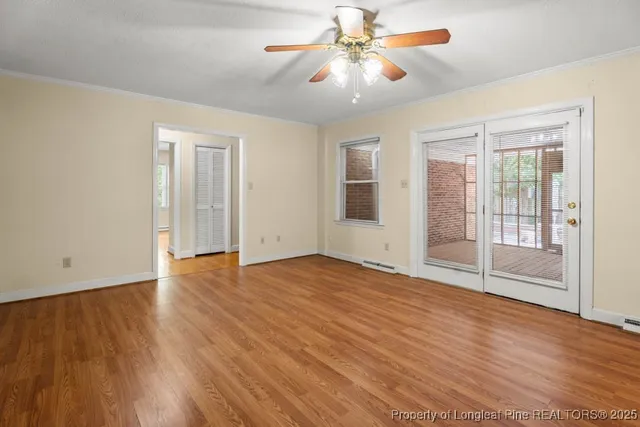a view of a balcony with wooden floor