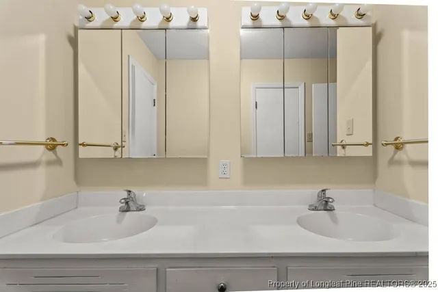 a bathroom with a toilet a sink and shower