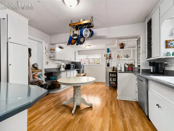 a view of kitchen with sink and microwave