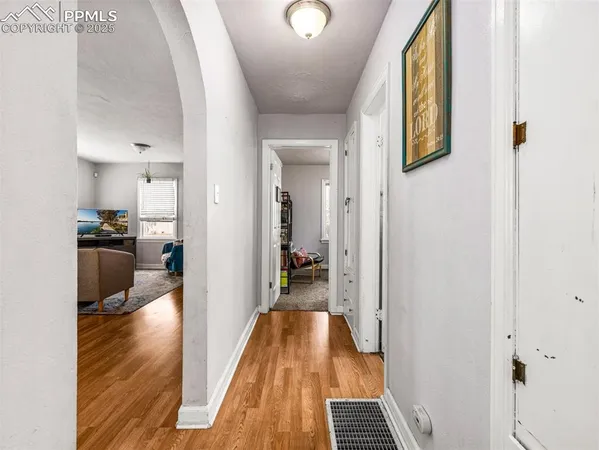 a view of a kitchen from the hallway