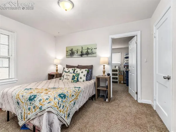 a bedroom with a bed and a table