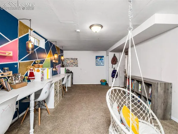 a view of a room with furniture and toys