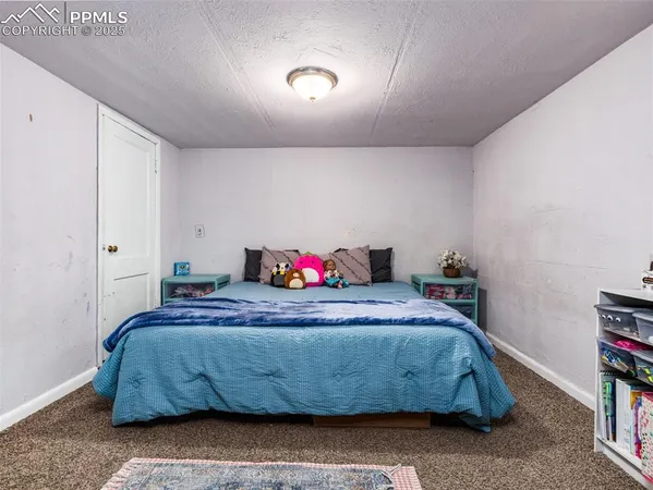 a bedroom with a bed and a book shelf
