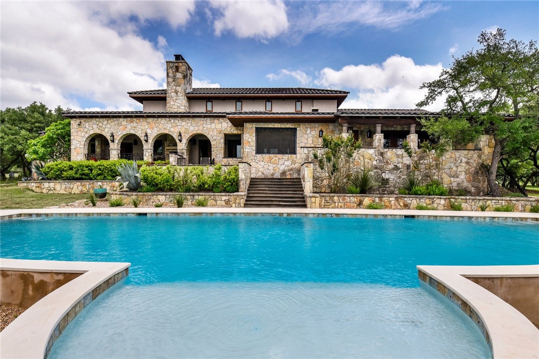 a view of swimming pool with outdoor seating and front view