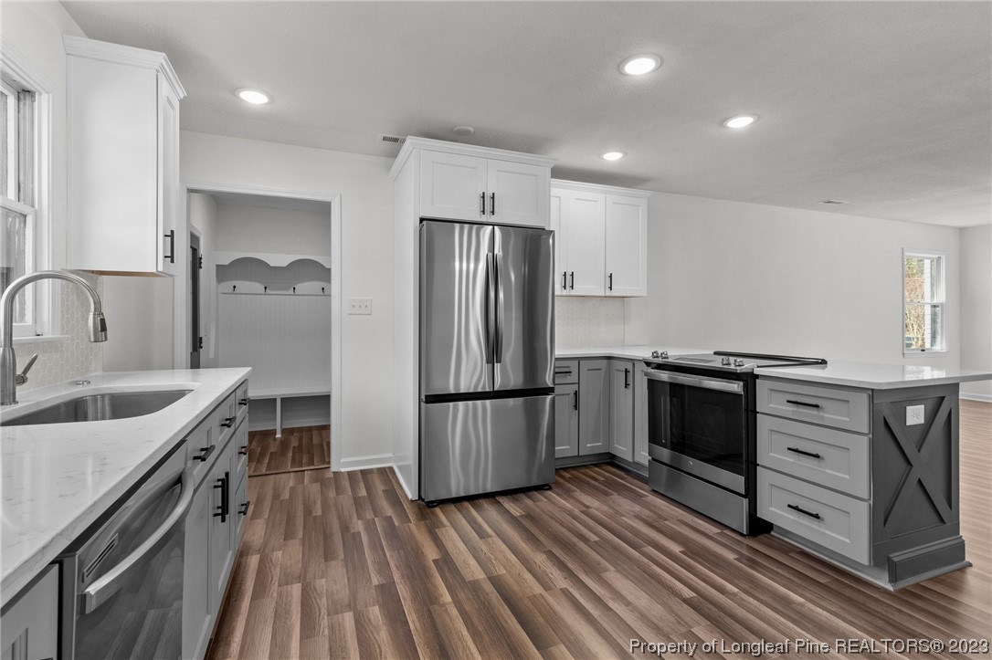 4659 Tabor Church Road Fayetteville, NC 28312 - Photo 11 of 50 a kitchen with stainless steel appliances granite countertop a refrigerator stove and sink