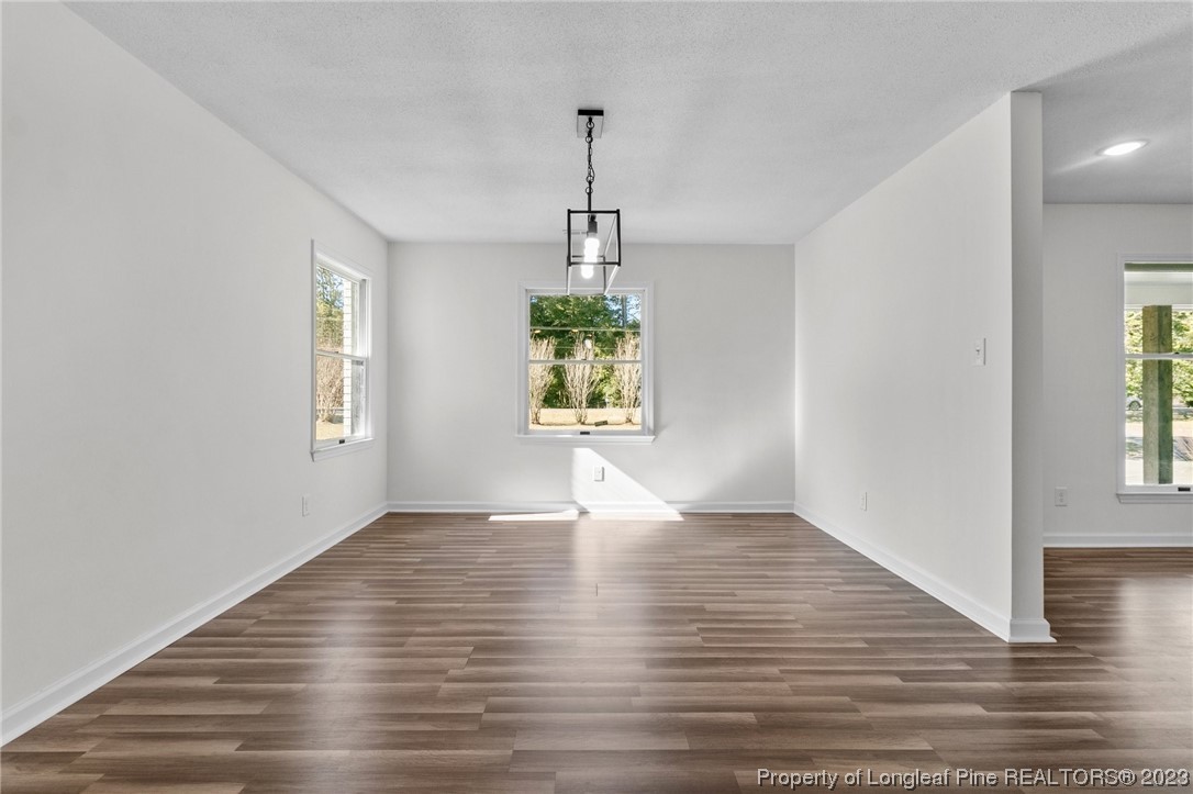 4659 Tabor Church Road Fayetteville, NC 28312 - Photo 13 of 50 a view of an empty room with window and wooden floor