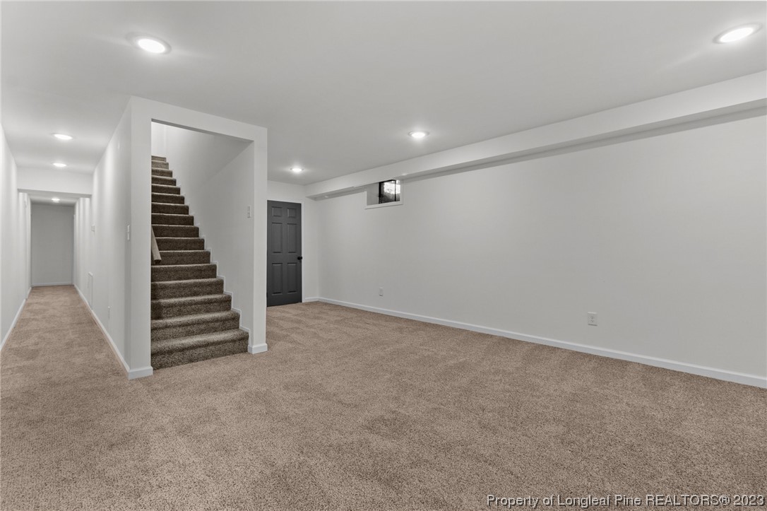 4659 Tabor Church Road Fayetteville, NC 28312 - Photo 29 of 50 wooden view of an empty room with stairs and ventilation